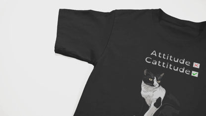 camera pans over a black shirt with a black cat on it and some text