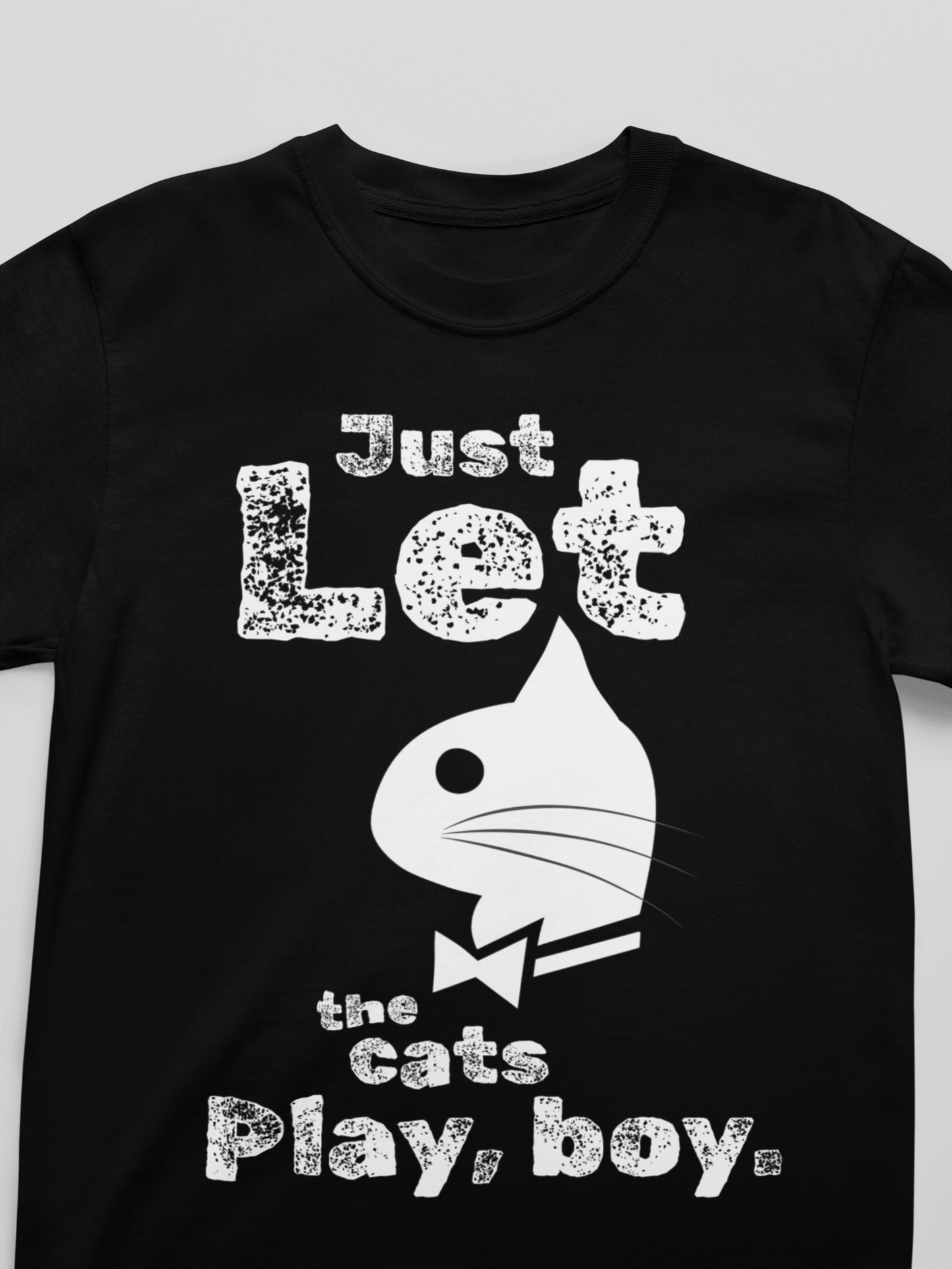 Black t-shirt with white text and graphic design on a gray background
