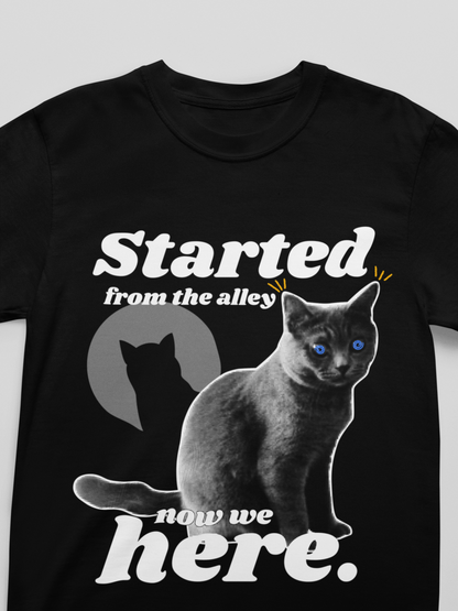 Black t-shirt with a cat graphic and text on a white background