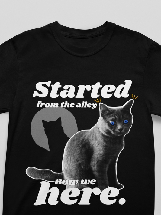 Black t-shirt with a cat graphic and text on a white background